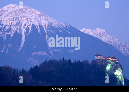 View across the beautiful Lake Bled, island church and hilltop castle when the lake was frozen over. Stock Photo