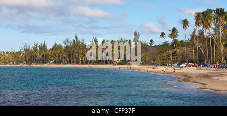 LUQUILLO, PUERTO RICO - People enjoying public beach. Stock Photo