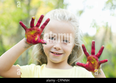 Girl with paint covered hands, portrait Stock Photo