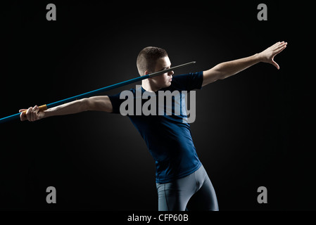 Male athlete preparing to throw javelin Stock Photo