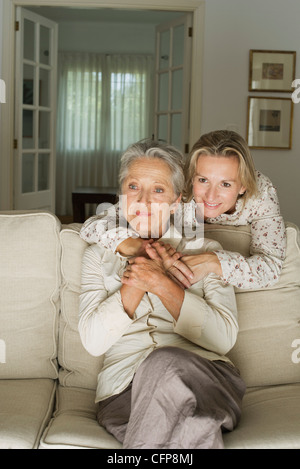 Mother and daughter spending time in living room Stock Photo