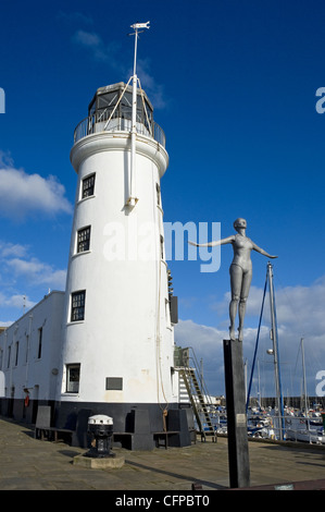 Figure of the Diving Belle next to the Lighthouse in winter Scarborough North Yorkshire England UK United Kingdom GB Great Britain Stock Photo