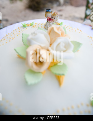 Weddings at the dream beaches on The Seychelles are romantic and common. This German couple enjoys their ceremony on Prasline. Stock Photo