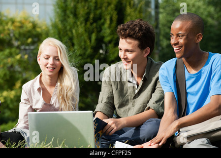 University students spending time together outdoors Stock Photo
