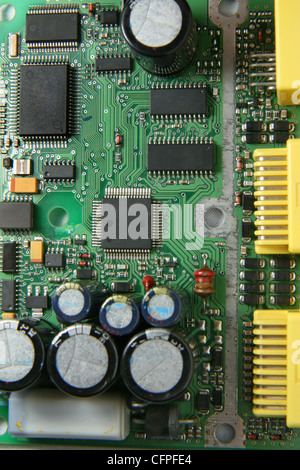 A printed circuit board with various electronic devices mounted on it. Stock Photo