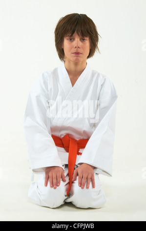 boy practicing karate on white background Stock Photo