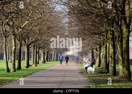 Joggers in Glasgow Green public park in winter, Scotland, UK Stock Photo