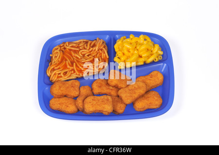 Lunch tray of breaded chicken nuggets, spaghetti with tomato sauce and macaroni and cheese on white background cut out. Stock Photo