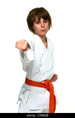 boy practicing karate on white background Stock Photo