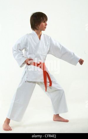 boy practicing karate on white background Stock Photo