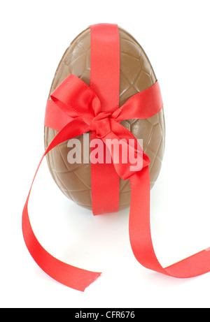 Chocolate easter egg wrapped with a red ribbon bow Stock Photo