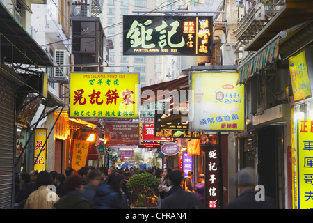 Crowds walking along food street of Rua da Cunha,Taipa, Macau, China, Asia Stock Photo