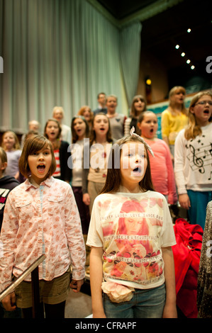 The 'Only Kids Aloud' welsh children's choir rehearsing Mahler's 8th Symphony at Aberystwyth Arts Centre, Wales UK Stock Photo