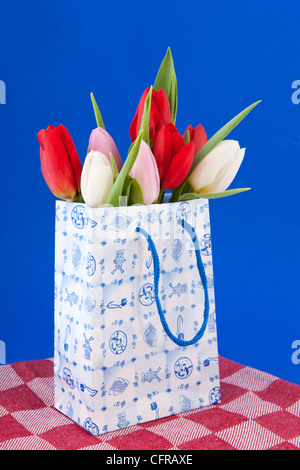 Dutch souvenir shopping bag with bouquet tulips Stock Photo