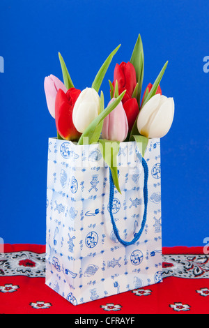 Dutch souvenir shopping bag with bouquet tulips Stock Photo