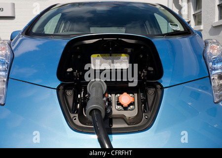 Fast charging a Nissan Leaf electric car at an electrical charging point offering an EV 30 minute charge ..(More in Description) Stock Photo