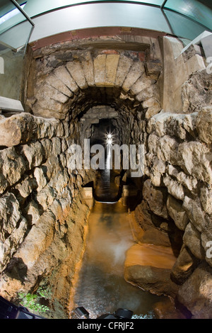 Looking along the Roman drain in the Roman Baths museum in Bath, Somerset Stock Photo