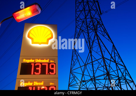 A petrol sation in Billingham on Teeside, UK, with an electricity pylon at dusk. Stock Photo