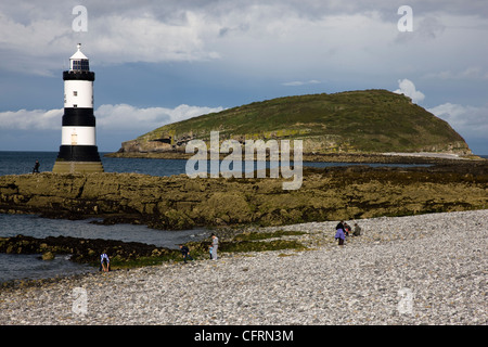 Penmon Point lighthouse and Puffin Island in Anglesey, North Wales Stock Photo