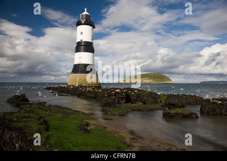 Penmon Point lighthouse and Puffin Island in Anglesey, North Wales Stock Photo