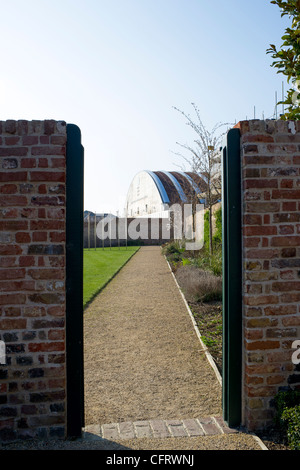 The Royal Opera House workshop building at Purfleet, Essex is viewed through a gateway in its grounds. Stock Photo