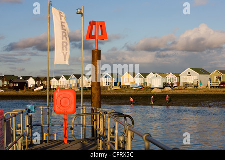 Ferry jetty and beach huts at Hengistbury Head near Bournemouth in Dorset Stock Photo