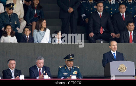 Dec 01, 2006; Mexico City, MEXICO; Mexico's new President FELIPE CALDERON speaks to the armed forces at a marching field in Mexico City December 1, 2006 as his family (L-R) MARIA, LUIS FELIPE, his wife MARGARITA ZAVALA, and JUAN PABLO watch. Calderon was sworn in as Mexico's president on Friday desp Stock Photo