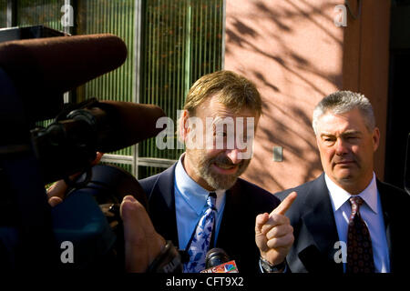 December 20, 2006, San Diego, CA EUGENE IREDALE (CQ), center, and KERRY STEIGERWALT, right, who both represent ARTURO VILLAREAL HEREDIA, speak to members of the press outside Federal Court in downtown San Diego where HEREDIA and JAVIER ARRELANO FELIX were arraigned Wednesday morning on charges that  Stock Photo