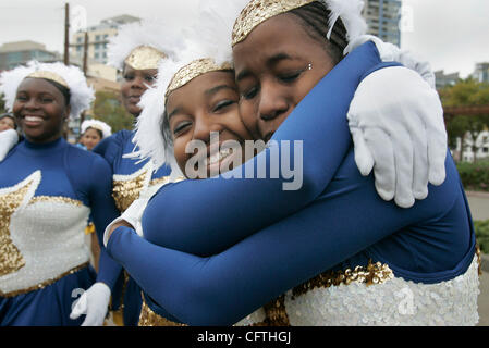 January 13, 2007 San  Diego, CA  San Diegans celebrated the life of Martin Luther King downtown by following a circular route around Petco Park.  TRAISHELLE HILL, 17,  left, hugs SHIRLEE MOORE, 17, at the end of the Martin Luther King Jr. Parade downtown.  Both seniors were emotional after performin Stock Photo