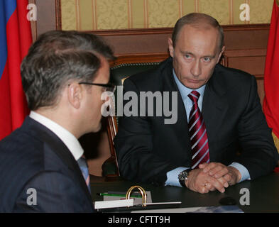 Vladimir Putin and Russian Minister for Economic Development and Trade German Gref(l). Stock Photo