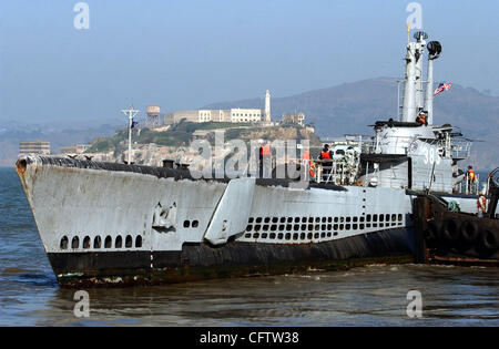 The USS Pampanito, a WW II submarine, is moved by two tugboats from Pier 45 in San Francisco, Calif., Tuesday, Jan. 23, 2007,  to a dry dock at Bay Ship and Yacht in Alameda where it will be cleaned up and returned. (Joanna Jhanda/Contra Costa Times) Stock Photo