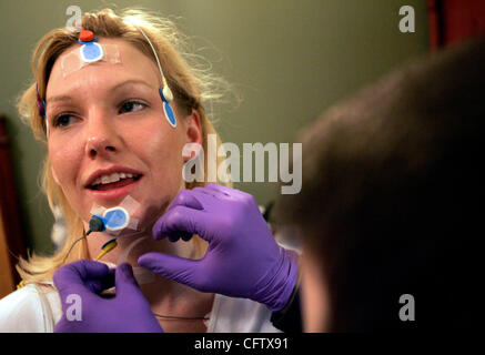 Laura Sigler of St. Paul is test fitted with a CPAP mask during a sleep ...