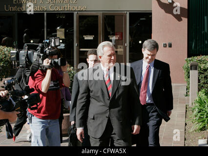 February 14, 2007 San Diego California USA---KYLE 'DUSTY' FOGGO (striped tie) left Federal Court in San Diego where he was arraigned on fraud and conspiracy charges along with BRENT WILKES in connection with former congressman RANDY 'DUKE' CUNNINGHAM.  WILKES AND FOGGO are childhood friends who grew Stock Photo