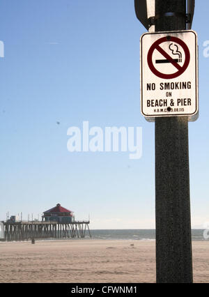 Mar 04, 2007 - Huntington Beach, CA, USA - Huntington Beach is a seaside city in Orange County in southern California and is also one of the first California cities to ban cigarette smoking on its beaches.  Activists in favor of the ban say it reduces refuse (cigarette butts) on the sand and in the  Stock Photo