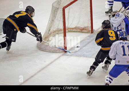 RENEE JONES SCHNEIDER ¥ reneejones@startribune.com.Minneapolis, MN - March 3, 2007 - Burnsville's Tyler Barnes came around the back of the net for a goal against Holy Angel's goalie Michael Webb in the first period of the section 5 finals Saturday at Mariucci Arena at the University of Minnesota.    Stock Photo