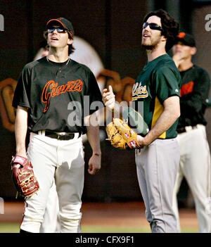 Oakland Athletics pitcher Barry Zito looks at the scoreboard after