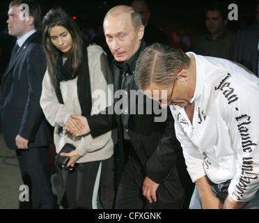 Russian President Vladimir Putin and actor Jean Claude Van Damme at the fight tournament in St.Petersburg. Van Damme`s daughter Bianca is next to Putin. Stock Photo