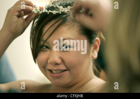 April 14, 2007 - Edina, MN -  Nancy Yang, 17, a student at Agricultural and Food Science Academy, tries on a tierra at this year's Operation Glass Slipper at Southdale Mall.  Operation Glass Slipper offered more than 1800 prom dresses free for Minnesota high school  girls who otherwise cannot afford Stock Photo