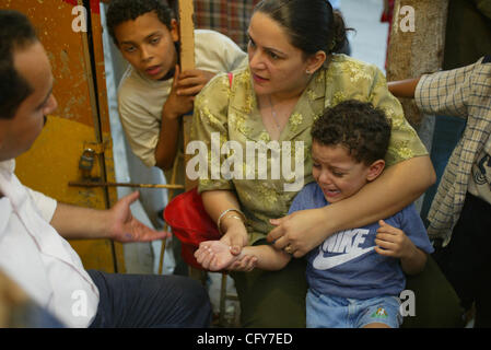 Samaan El Kharaz cave church, also known as Church of St Ibram Ibn Zaraa El Soriany, Moqattam, Cairo, Egypt. It is a common practice for Coptic Christians to have their children tattoed with the 'marks of Christ. The church in Moqattam, Cairo is made up of 3 sets of caves. The largest one is said to Stock Photo