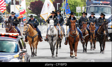 The Alameda County Sheriff's Mounted Posse rides during the Rowell Ranch Rodeo Parde on Saturday, May 12, 2007, in Castro Valley, Calif. (Jane Tyska/The Daily Review) Stock Photo