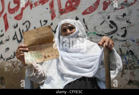 May 15, 2007 - Rafah Refugee Camp, Gaza Strip - 78 year-old Palestinian lady RASMIA AL-AKARAS presents a paper proving the ownership of her house in Wadi Hanin Village beside Beersheba in the occupied territories since 1948, on the 59th anniversary of the 'Nakba (catastrophe ) Day'. She now lives in Stock Photo