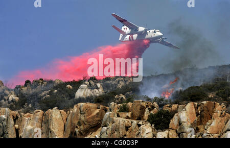 August 1, 2007, San Diego, California, USA  A air tanker drops flame retartant on fires at the top of Cowles Mountian at Mission  Trails Regional Park Wednesday afternoon. Fire officials reported the fire at about 2 pm and said that about 60 acres were burned.  Mandatory Credit: Photo by EARNIE GRAF Stock Photo