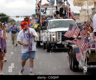 Jul 04, 2007 - Fredericksburg, TX, USA - STEPHEN FRY sorts through strands of beads he and others in the HIll Country Memorial Hospital float handed out to parade watchers during the Fredericksburg Fourth of July parade on Wednesday July 4, 2007.   (Credit Image: © Helen L. Montoya/San Antonio Expre Stock Photo