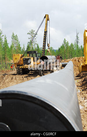 Construction of oil pipeline East Siberia - Pacific Ocean.The ambitious East Siberia-Pacific Ocean oil pipeline, managed by state-run oil pipe operator Transneft, is slated to pump up to 1.6 million barrels per day of crude from Siberia to Russia`s Far East, which will then be sent on to China and t Stock Photo