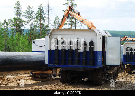 Construction of oil pipeline East Siberia - Pacific Ocean.The ambitious East Siberia-Pacific Ocean oil pipeline, managed by state-run oil pipe operator Transneft, is slated to pump up to 1.6 million barrels per day of crude from Siberia to Russia`s Far East, which will then be sent on to China and t Stock Photo