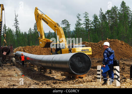 Construction of oil pipeline East Siberia - Pacific Ocean.The ambitious East Siberia-Pacific Ocean oil pipeline, managed by state-run oil pipe operator Transneft, is slated to pump up to 1.6 million barrels per day of crude from Siberia to Russia`s Far East, which will then be sent on to China and t Stock Photo