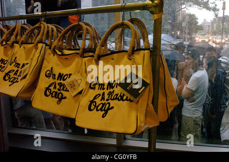 A rack of 'I'm Not A Plastic Bag' totes. Thousands line up for Whole Foods Market launch of 'I'm Not A Plastic Bag' shopping totes designed by Anya Hindmarch at select Whole Foods Markets in New York City. Designer Anya Hindmarch is on location at the Whole Foods Market Bowery for the New York City  Stock Photo