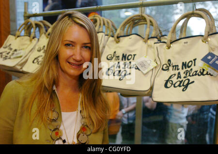 Designer Anya Hindmarch stands before a rack of her 'I'm Not A Plastic Bag' totes. Thousands line up for Whole Foods Market launch of 'I'm Not A Plastic Bag' shopping totes designed by Anya Hindmarch at select Whole Foods Markets in New York City. Designer Anya Hindmarch is on location at the Whole  Stock Photo