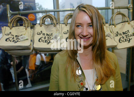 Designer Anya Hindmarch stands before a rack of her 'I'm Not A Plastic Bag' totes. Thousands line up for Whole Foods Market launch of 'I'm Not A Plastic Bag' shopping totes designed by Anya Hindmarch at select Whole Foods Markets in New York City. Designer Anya Hindmarch is on location at the Whole  Stock Photo