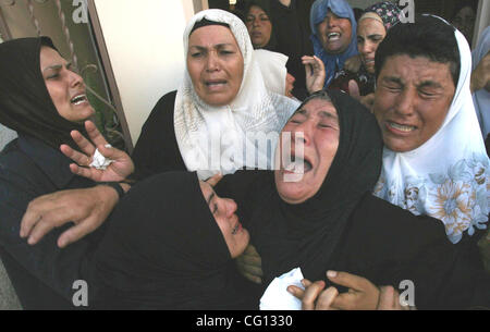 Jul 22, 2007 - Beit Hanoun, Gaza Strip - Palestinian mourners cry during the funeral of Islamic Jihad militant Abed al-Rahman who was one of two killed in an Israeli airstrike after firing rockets at Israel. Stock Photo